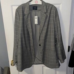Gray woman’s blazer, size XL, never been worn